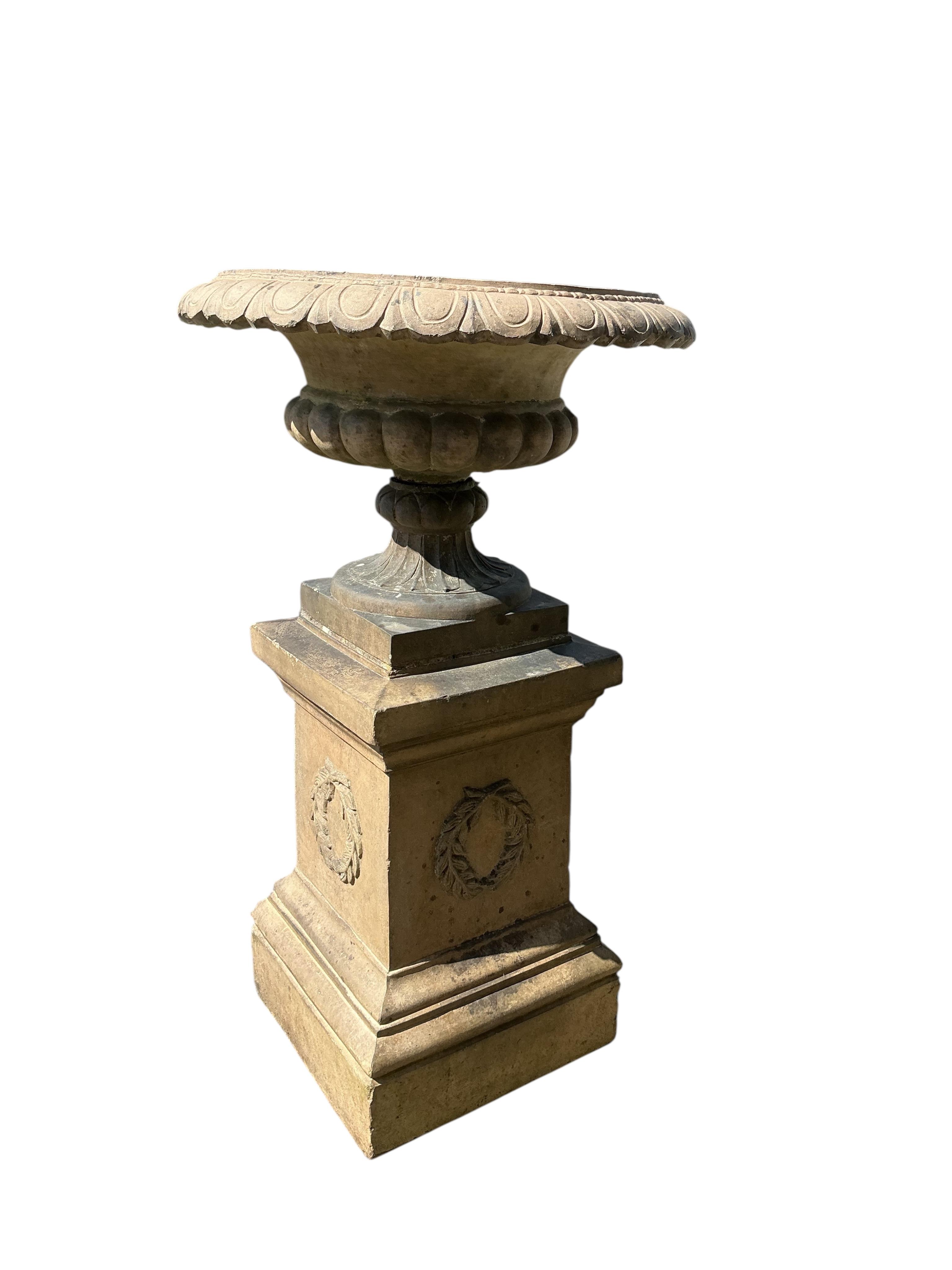 A Victorian Gibbs & Canning, Tamworth earthenware garden campana urn, on square pedestal base, diameter 65cm, height 113cm